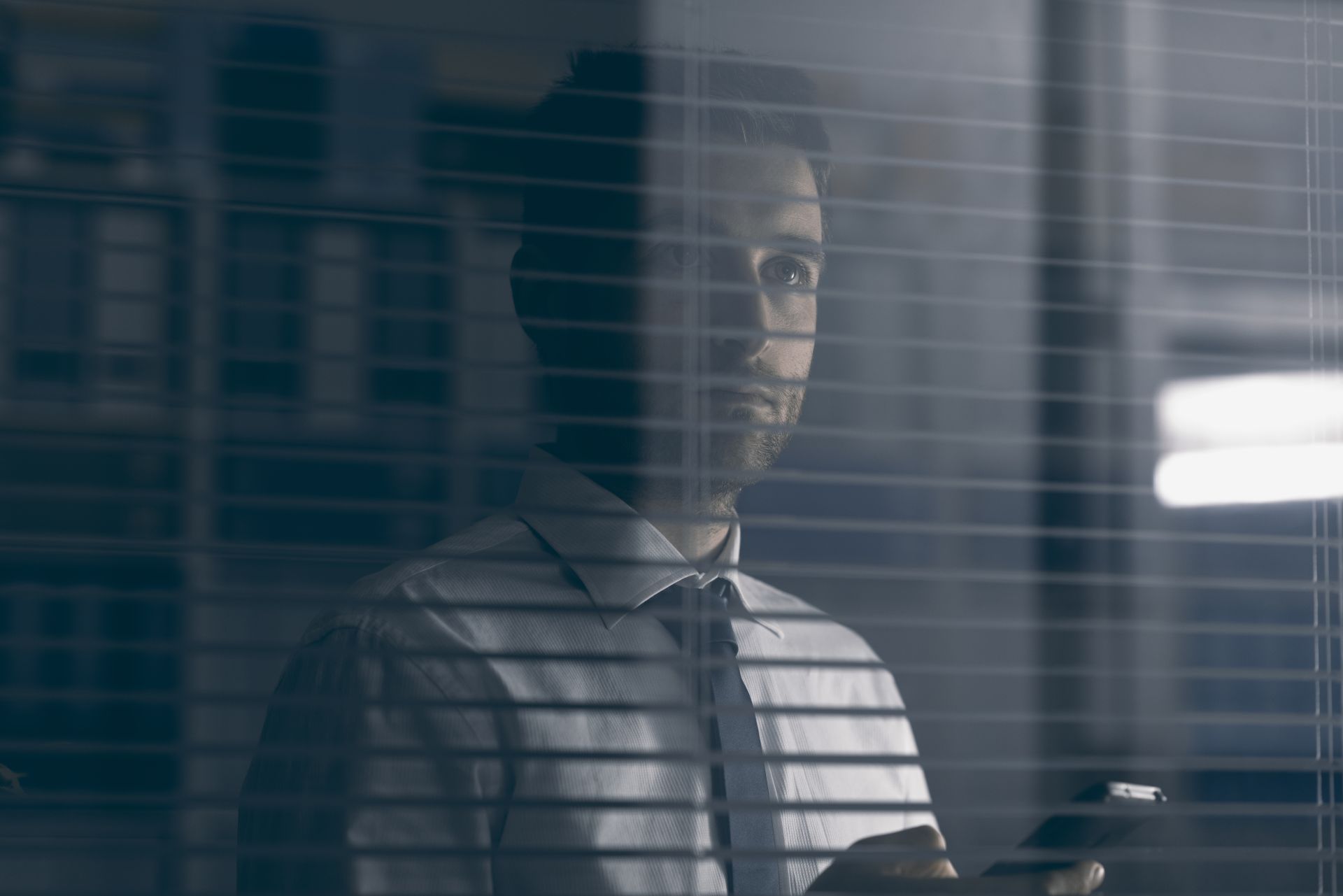 corporate executive holding a smartphone pqrjcs4.jpg